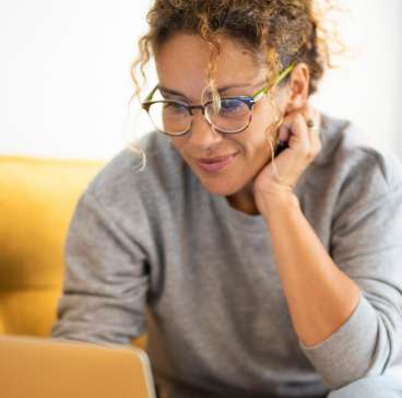 Woman typing on her laptop.